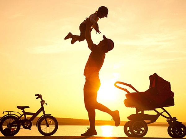 happy father with child on sunset